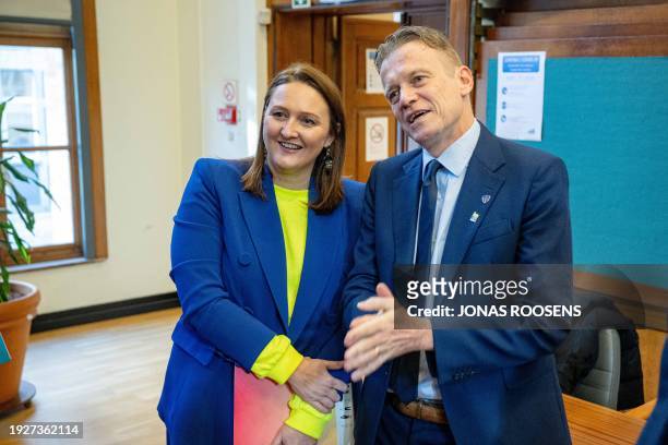 Belgium's Minister of Justice Paul Van Tigchelt poses with Flemish Minister of Domestic Policy and Living Together Gwendolyn Rutten before the start...