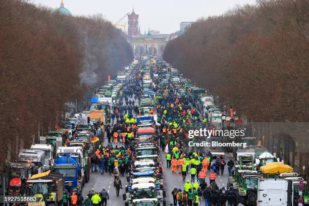 Farmers protest against the German government's planned cuts to agricultural sector subsidies near the Brandenburg Gate in Berlin, Germany, on...