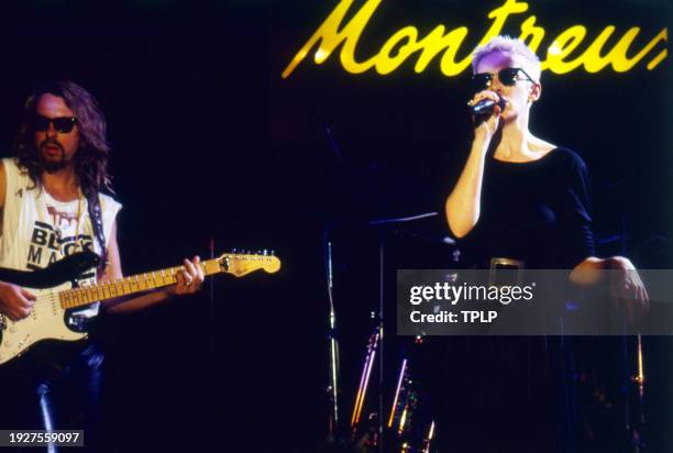 Photo of New Wave and Pop musicians Dave Stewart and Annie Lennox, both of the duo Eurythmics, perform onstage at the Montreux Rock Festival,...
