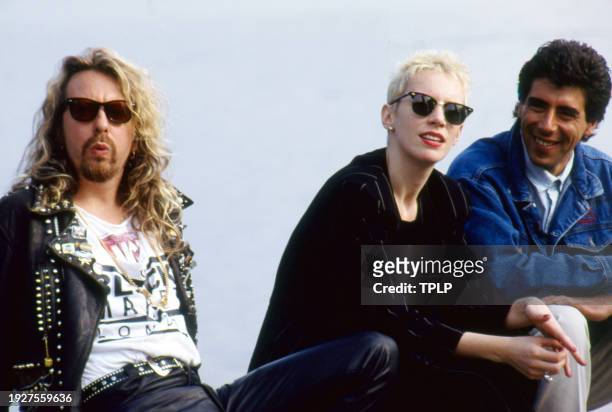 Portrait of, from left, New Wave and Pop musicians Dave Stewart and Annie Lennox, both of the duo Eurythmics, and DJ Gary Davies during an interview...