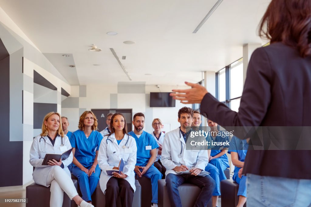 Group of doctors and nurses attending healthcare seminar