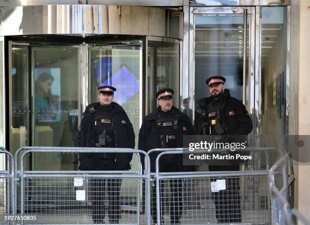 Police officers stand behind security barriers outside the London Stock Exchange and make sure normal business can continue on January 15, 2024 in...