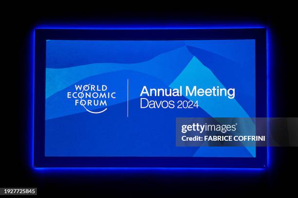 This photograph taken on January 15, 2024 shows a sign of the World Economic Forum displayed at the Congress center during WEF's annual meeting in...