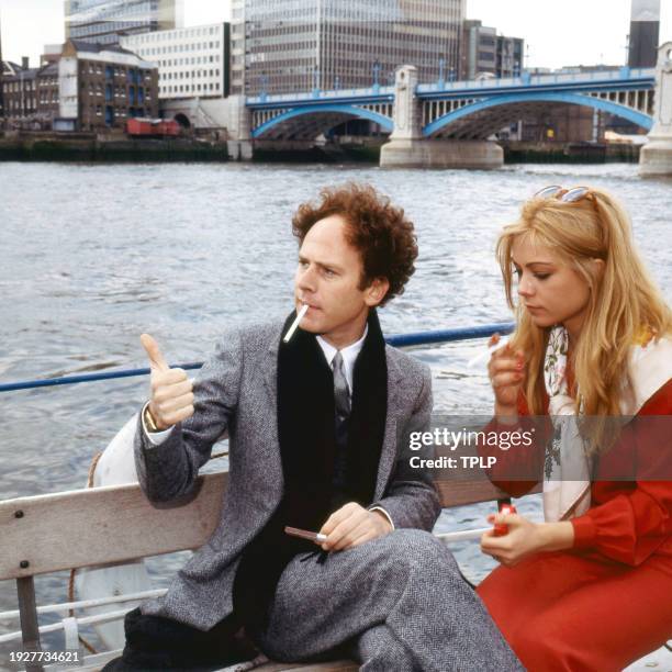 Photo of American actors Art Garfunkel and Theresa Russell on a boat on the Themes, London, England, May 6, 1979.