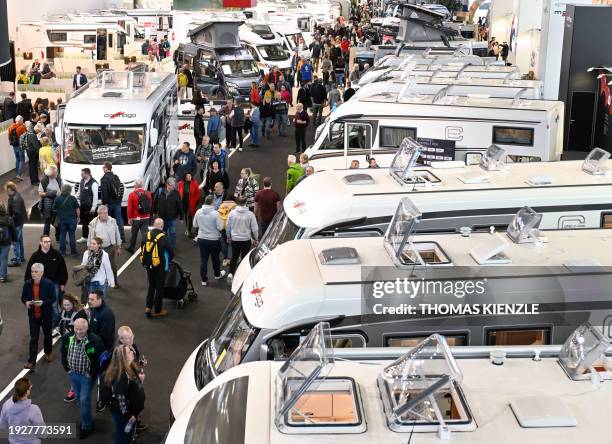 Motorhomes stand in a hall of the Caravan, Motor and Tourism CMT fair on the fairgrounds in Stuttgart, southern Germany on January 15, 2024. The fair...