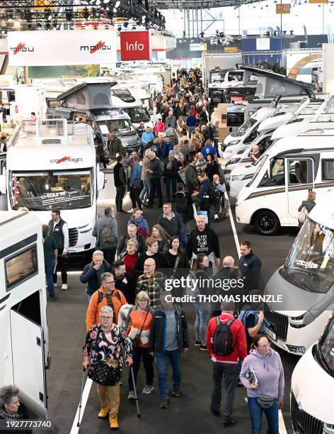 Motorhomes stand in a hall of the Caravan, Motor and Tourism CMT fair on the fairgrounds in Stuttgart, southern Germany on January 15, 2024. The fair...