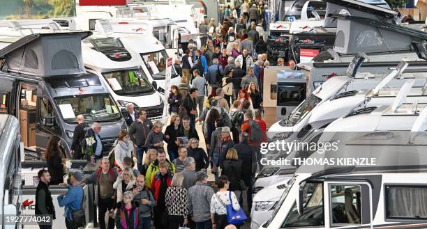 Motorhomes stand in a hall of the Caravan, Motor and Tourism CMT fair on the fairgrounds in Stuttgart, southern Germany on January 15, 2024. The fair...