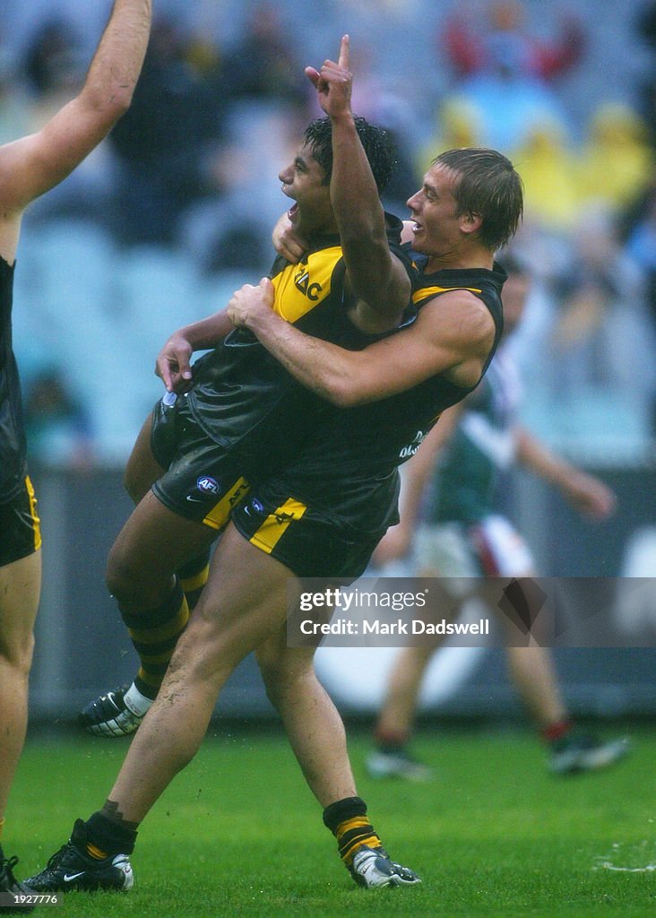 David Rodan David Rodan of the Tigers is lifted off the ground by Mark Coughlan ...