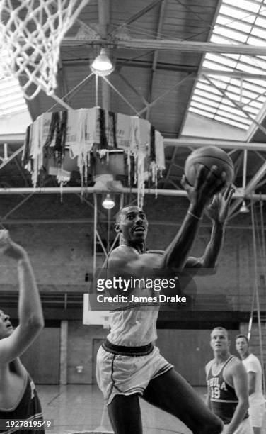 Wilt Chamberlain of the Philadelphia Warriors in action during a practice at the Milton Hershey School in 1959 in Hershey, Pennsylvania.