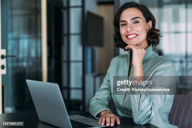 successful businesswoman in modern office working on laptop. - unemployed marketing professional searches for a job stock pictures, royalty-free photos & images