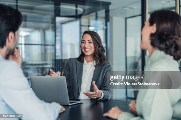 group of business persons talking in the office. - bank customer stock pictures, royalty-free photos & images