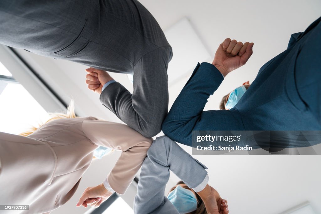 Elbow bump from below