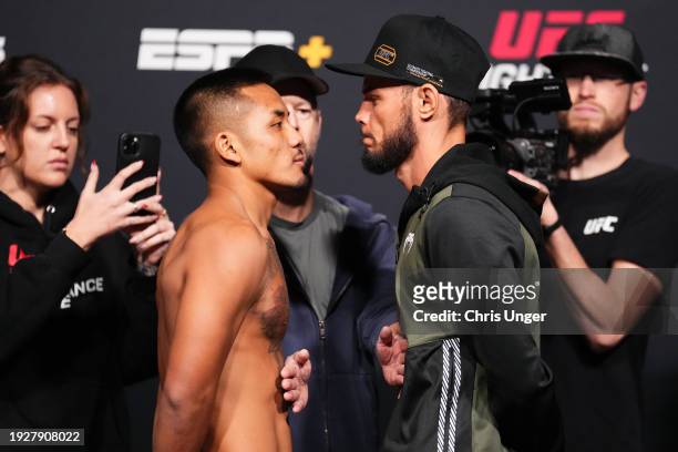 Opponents Joshua Van of Myanmar and Felipe Bunes of Brazil face off during the UFC Fight Night weigh-in at UFC APEX on January 12, 2024 in Las Vegas,...