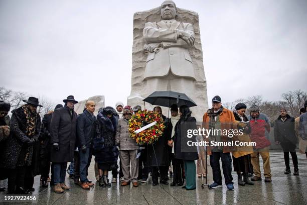 Martin Luther King III , the son of civil rights leader Dr. Martin Luther King Jr., and others place a memorial wreath at the foot of a statue of his...