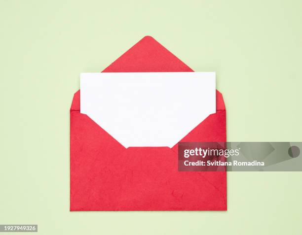 open envelope with sheet of paper - busta foto e immagini stock