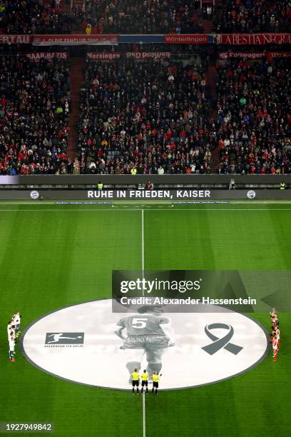 General view inside the stadium whilst the players of both teams pause for a minutes silence as a memorial banner is displayed in the centre of the...