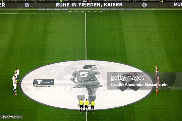 General view inside the stadium whilst the players of both teams pause for a minutes silence as a memorial banner is displayed in the centre of the...