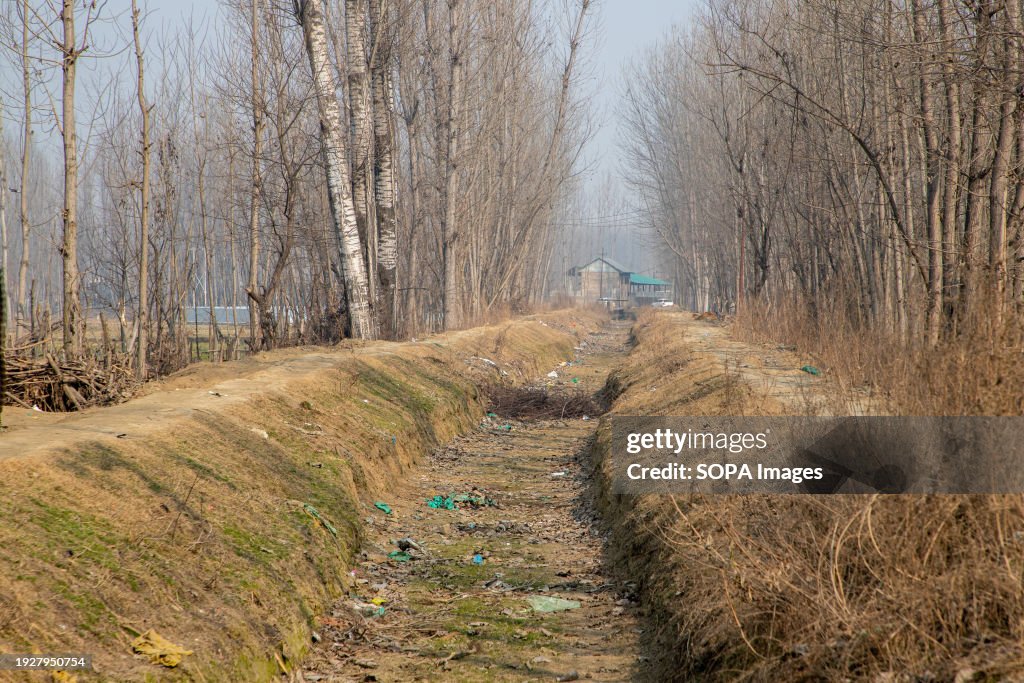 General view of dry water canal on a cold winter day in...