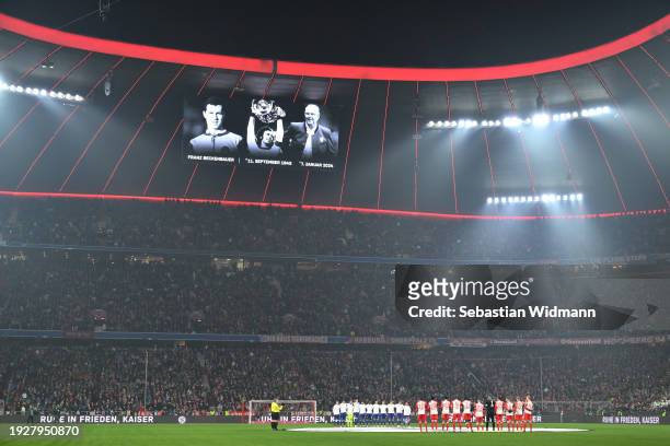 General view inside the stadium whilst the players of both teams pause for a minutes silence as a memorial image is displayed on the scoreboard after...