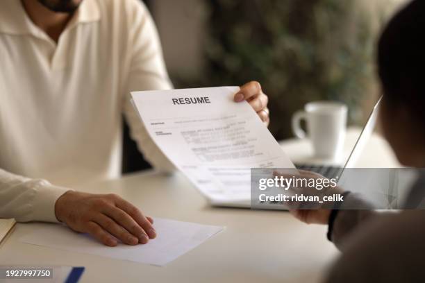businessman or hr manager is reviewing resume information - cv bildbanksfoton och bilder