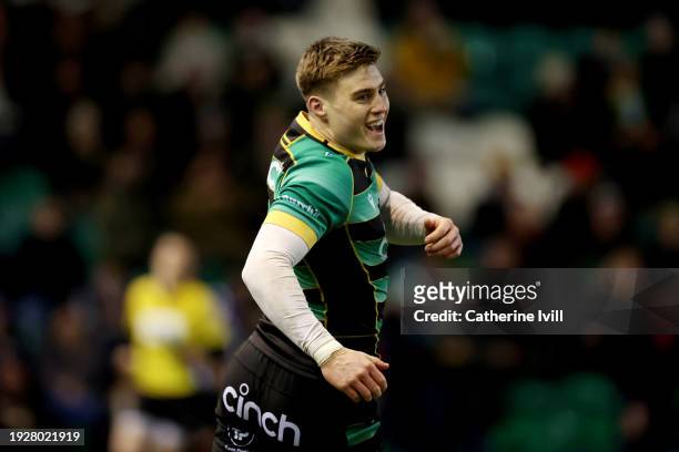 Tommy Freeman of Northampton Saints celebrates scoring their team's first try during the Investec Champions Cup match between Northampton Saints and...