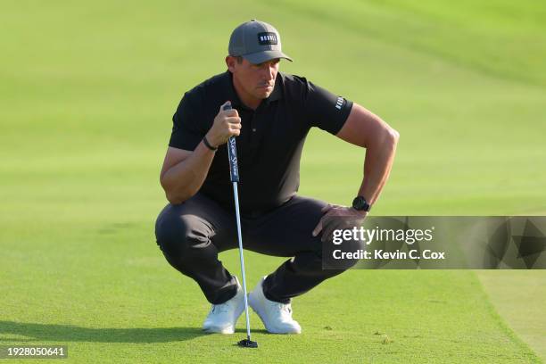 Scott Stallings of the United States lines up a putt on the third green during the second round of the Sony Open in Hawaii at Waialae Country Club on...