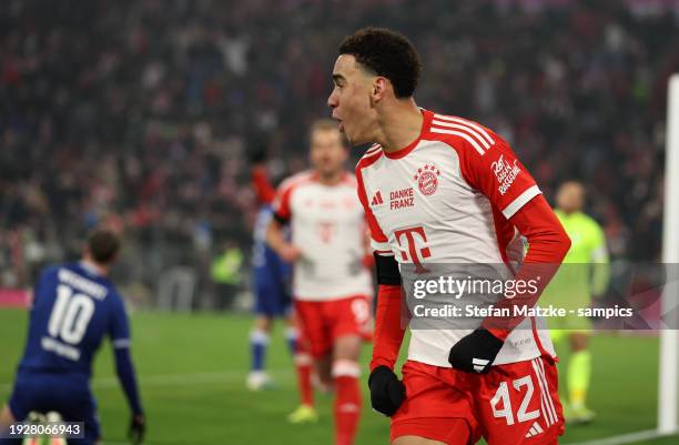 Jamal Musiala of FC Bayern Muenchen celebrates after scoring his team's first goal during the Bundesliga match between FC Bayern München and TSG...