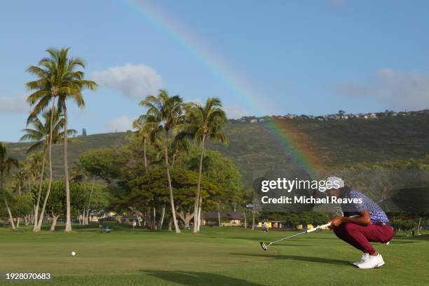 Akshay Bhatia of the United States lines up a putt on the 13th green during the second round of the Sony Open in Hawaii at Waialae Country Club on...