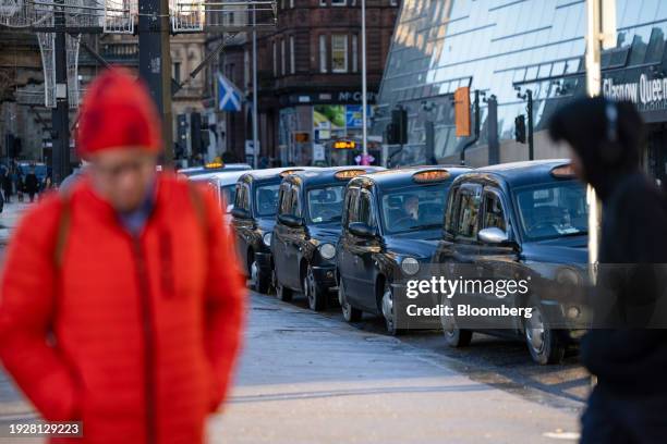 Taxis waiting outside Glasgow Queen Street railway station in Glasgow, UK, on Monday, Jan. 15, 2024. The Office of National Statistics will release...