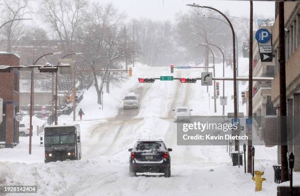 Heavy snow continues to fall on January 12, 2024 in Sioux City, Iowa. The second winter weather system in a week is bringing blizzard conditions...