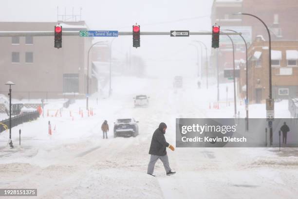 Heavy snow continues to fall on January 12, 2024 in Sioux City, Iowa. The second winter weather system in a week is bringing blizzard conditions...