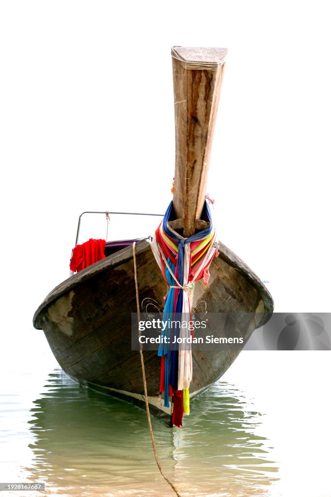 A longtail boat in the water.