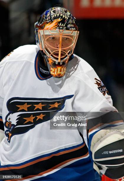 Olaf Kolzig of the Washington Capitals skates against the Toronto Maple Leafs during NHL game action on October 13, 2003 at Air Canada Centre in...