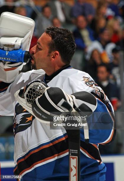 Olaf Kolzig of the Washington Capitals skates against the Toronto Maple Leafs during NHL game action on October 13, 2003 at Air Canada Centre in...