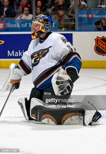 Olaf Kolzig of the Washington Capitals skates against the Toronto Maple Leafs during NHL game action on October 13, 2003 at Air Canada Centre in...