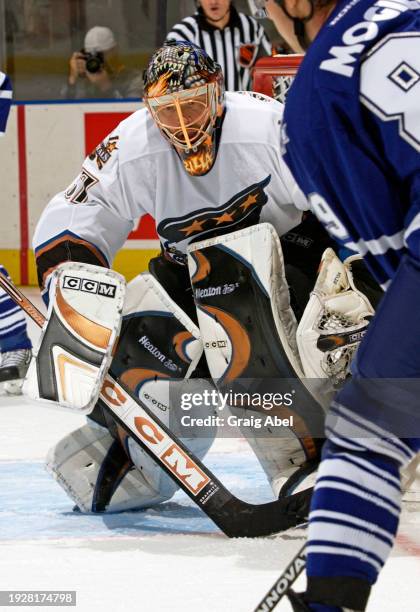 Olaf Kolzig of the Washington Capitals skates against the Toronto Maple Leafs during NHL game action on October 13, 2003 at Air Canada Centre in...