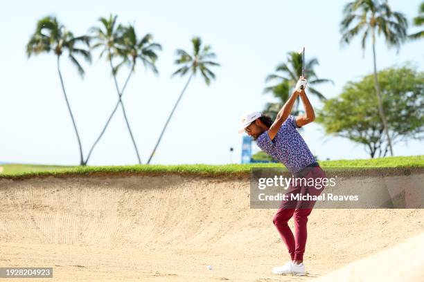 Akshay Bhatia of the United States plays a shot from a bunker on the 16th hole during the second round of the Sony Open in Hawaii at Waialae Country...