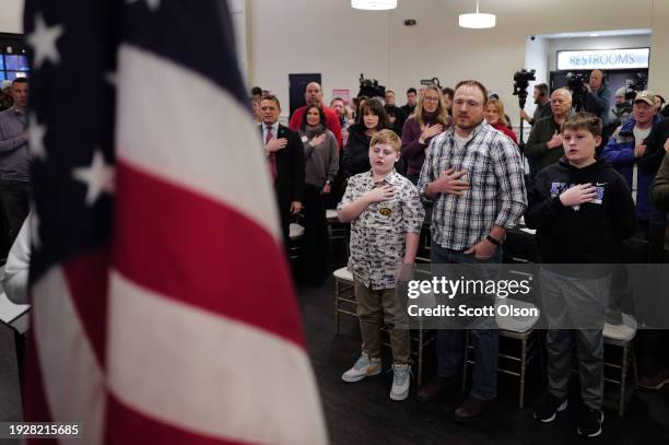 Guests recite the Pledge of Allegiance before listening to Republican presidential candidate Florida Governor Ron DeSantis speak to Northside...