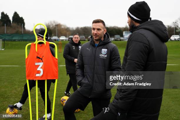 Damia Abella Statistical Analyst of West Bromwich Albion and West Bromwich Albion new loan signing Andreas Weimann chat whilst watching a training...
