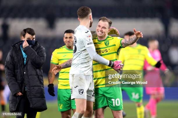 Ashley Barnes and Adam Forshaw of Norwich City celebrate following the team's victory in the Sky Bet Championship match between Hull City and Norwich...