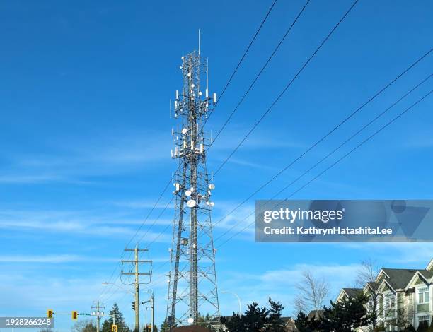 cell tower on fraser highway, surrey, canada - communications tower stock pictures, royalty-free photos & images