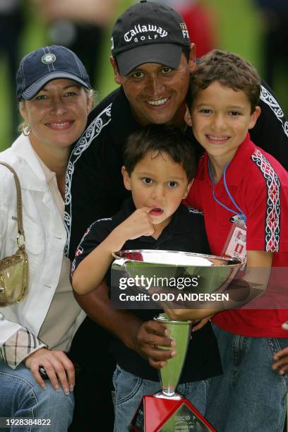 Michael Campbell of New Zealand poses with his wife Julia and children Jordan and Thomas after winning the World Match Play final against Irish...