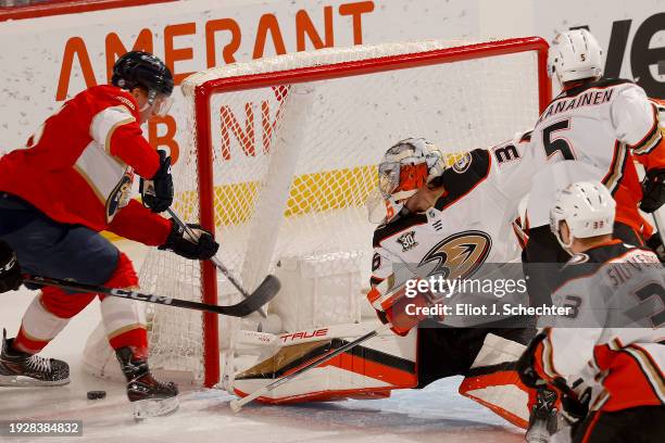 Goaltender John Gibson of the Anaheim Ducks defends the net against Anton Lundell of the Florida Panthers at the Amerant Bank Arena on January 15,...