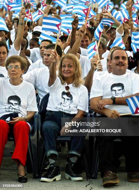 Dalia Soto del Valle, wife of Cuban President Fidel Castro , waves flag during the inauguration of the new school year in Havana 16 September, 2002....