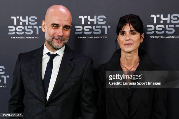 Manchester City Head Coach Pep Guardiola and his wife Cristina Serra poses for photos during the Green Carpet Arrivals at The Apollo Theatre on...