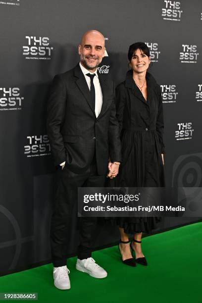 Pep Guardiola and Cristina Serra arrive on the Green Carpet ahead of The Best FIFA Football Awards 2023 at The Apollo Theatre on January 15, 2024 in...