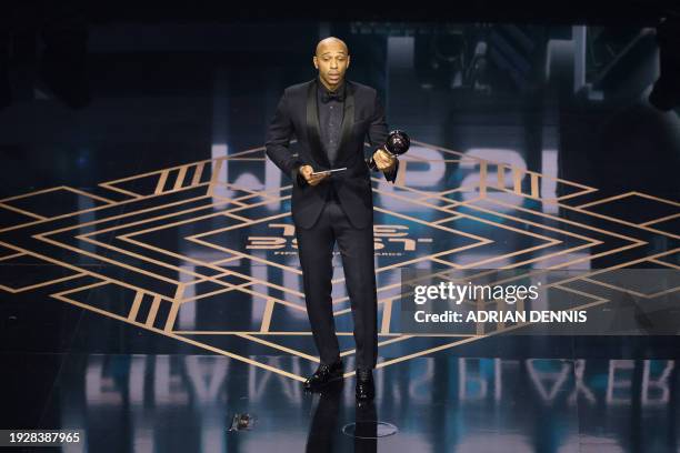 Thierry Henry reacts on stage after collecting The Best FIFA Men's Player award on behalf of Argentina and Inter Miami forward Lionel Messi during...