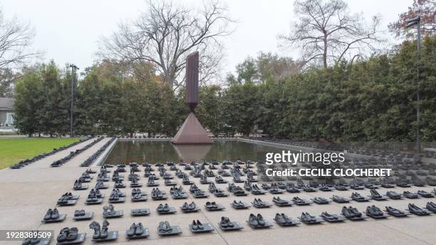 An installation by artist Sandeigh Kennedy of 657 pairs of shoes in memory of the more than 600 mass shootings that occurred in the United States in...
