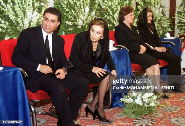 Farah Diba, the widow of Reza Pahlavi, the last Shah of Iran , listens to verses from the Koran 26 July 2000 during a ceremony marking the 20th...