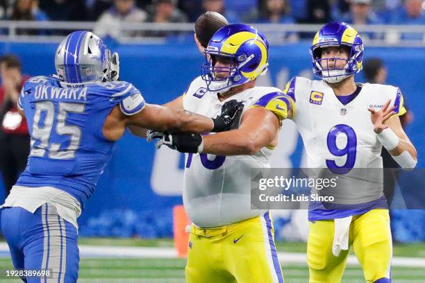 Los Angeles Rams quarterback Matthew Stafford throws a touchdown pass to wide receiver Tutu Atwell as offensive tackle Rob Havenstein works against...